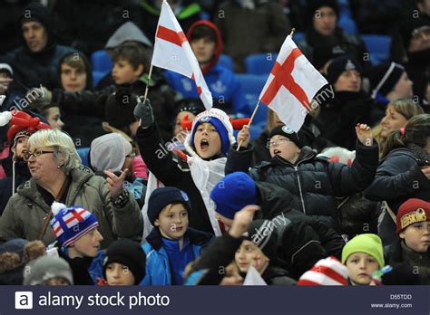 V2 is smaller, has updated links and better search functions. Young England football fans waving flags at a match UK ...