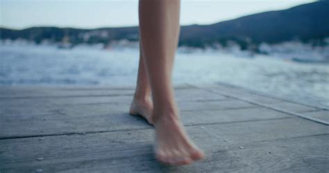 Close Up On Female Feet Walk On Wooden Pier Stock Footage SBV 347245379