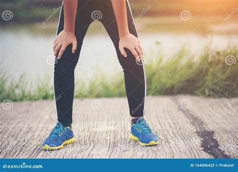 Tired Woman Runner Taking A Rest After Fast Running Stock Photo Image