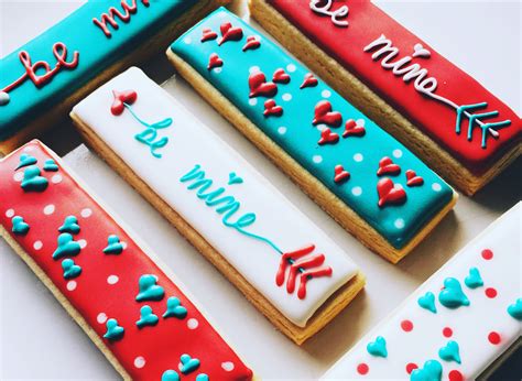 These are thick cut out cookies that hold their shape. Valentine's cookie sticks ... teal red and white valentine ...