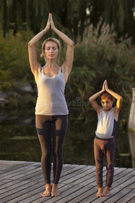 Mother And Son Exercising Yoga Pose Stock Image Image Of Nature Exercising