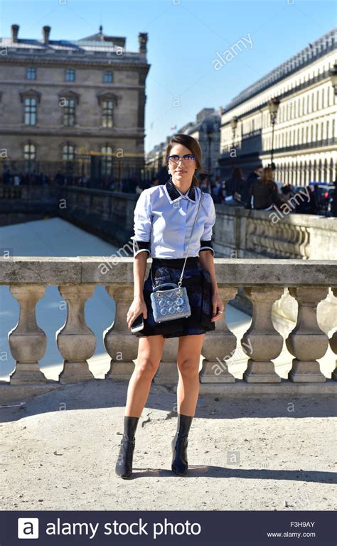 Blogger Camila Coelho Posing Outside Of The Dior Runway Show During