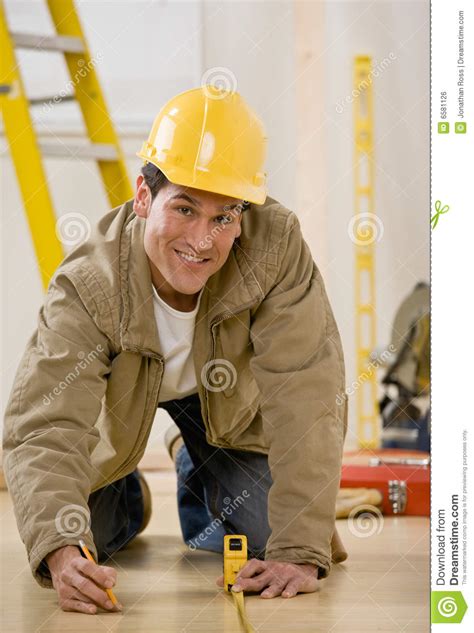 Construction Worker Using Measuring Tape Stock Photo - Image of ...