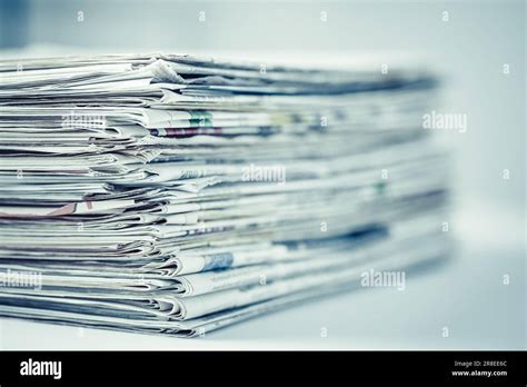 Pile Of Newspapers On Table Folded And Stacked Journals Stock Photo