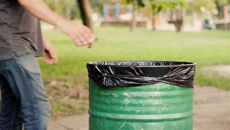 Throwing Away Garbage In Public Trash Can Stock Footage Video 10758917 Shutterstock