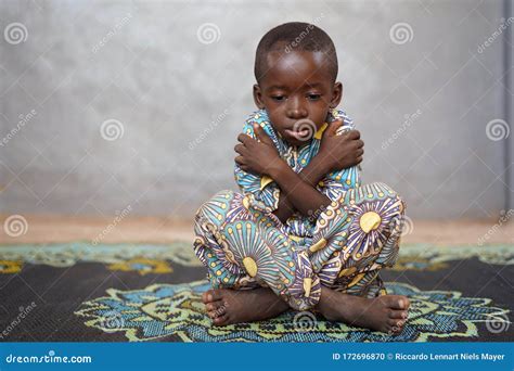 Sad Little African Boy Feels Sad In Despair And Lonely Stock Photo