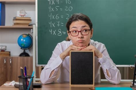 Free Photo Young Woman Teacher Wearing Glasses Holding Small