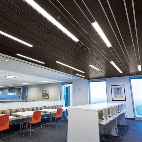 I love the touch of modern lines from the wood slats mixed with the natural stone wall, knotty shiplap and green metal console. Metal Ceilings | Armstrong Ceiling Solutions - Commercial