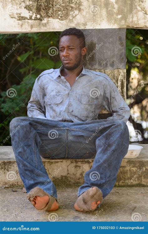 Young Homeless African Man Sitting On The Bridge Stock Image Image Of