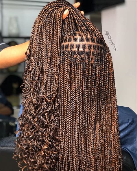20 small knotless box braids with curly ends