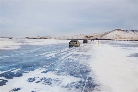 Winter Travel Cars Drive On Ice Ice Road On The Frozen Lake Baikal