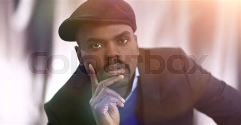 African American Man Posing With Hand On His Chin Stock Image Colourbox