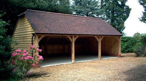 Solid wood garage carport designs for lawn robotic mower with opening roof. Pole Buildings & Garages | Timber garage, Carport designs, Pole building garage