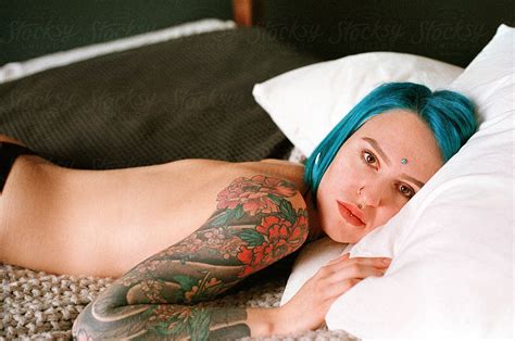 Tattooed Naked Woman On The Bed By Stocksy Contributor Alexey Kuzma