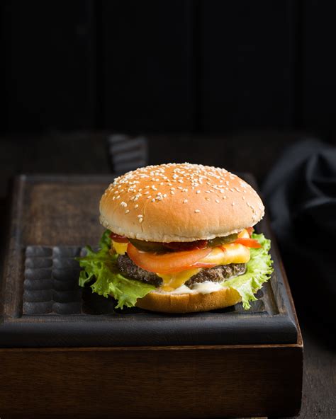 Burger With Sliced Vegetables Close Up Photography · Free Stock Photo