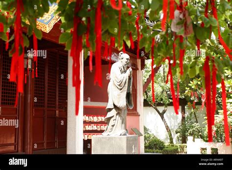 Statue Of Confucius And Prayer Ribbons At The Confucius Temple In