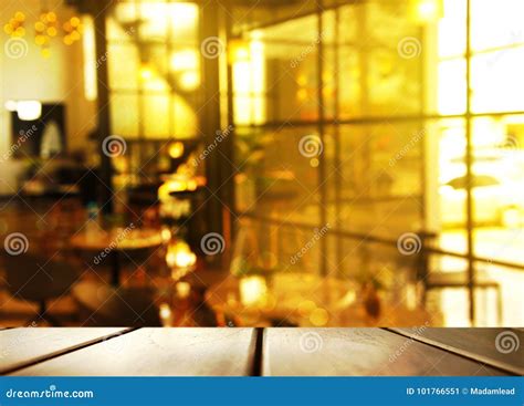 Top Of Wood Table With Blur Morning Light Of Glass Window In Cafe Or