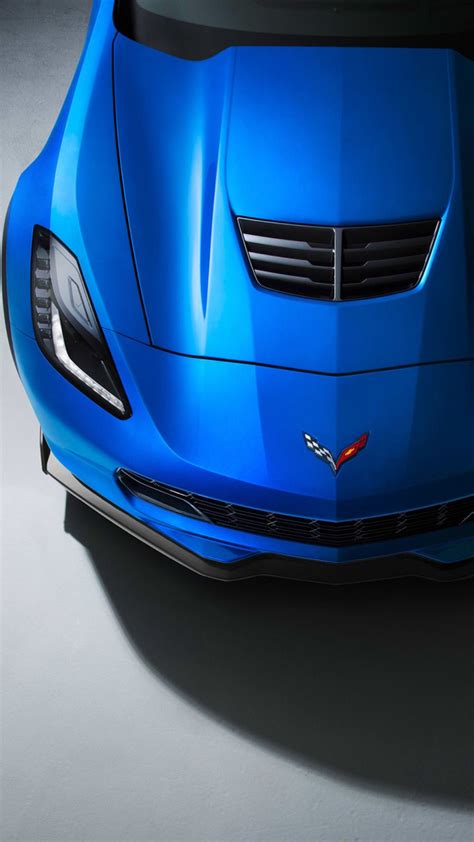 The Front End Of A Blue Sports Car