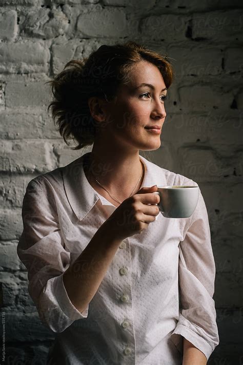 Woman Holding A Cup Of Coffee Del Colaborador De Stocksy Marija Savic Stocksy