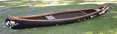 Lot Em White And Co Canoe In Black And Orange Paint Canvas Over