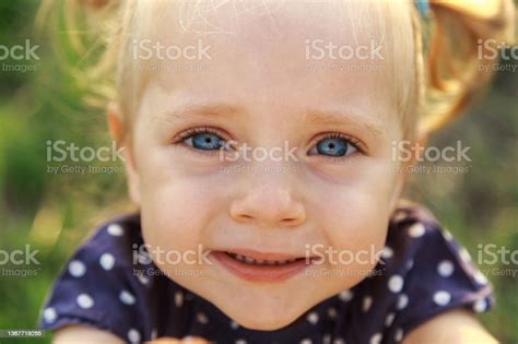 Portrait Of A Little Lovely Girl White Girl With Blue Eyes Cute Blonde