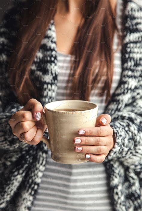 Girls Hands Holding A Cup Of Coffee Containing Take Cup And Away