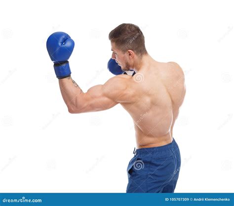 Muscular Guy In Boxing Glove Punches An Uppercut On A White Isolated
