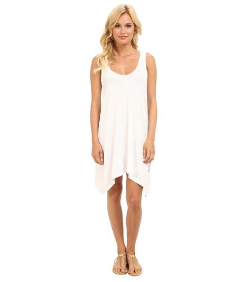 7 Little White Dress Styles To Try This Summer Little White Asymmetrical Dress White Dress