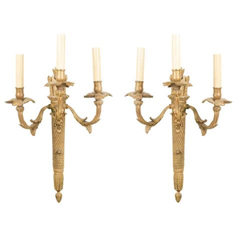 Pair Of French Art Deco Parchment And Brass Torch Wall Sconces For Sale