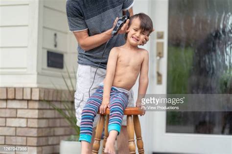 Father And Son Haircut Photos And Premium High Res Pictures Getty Images