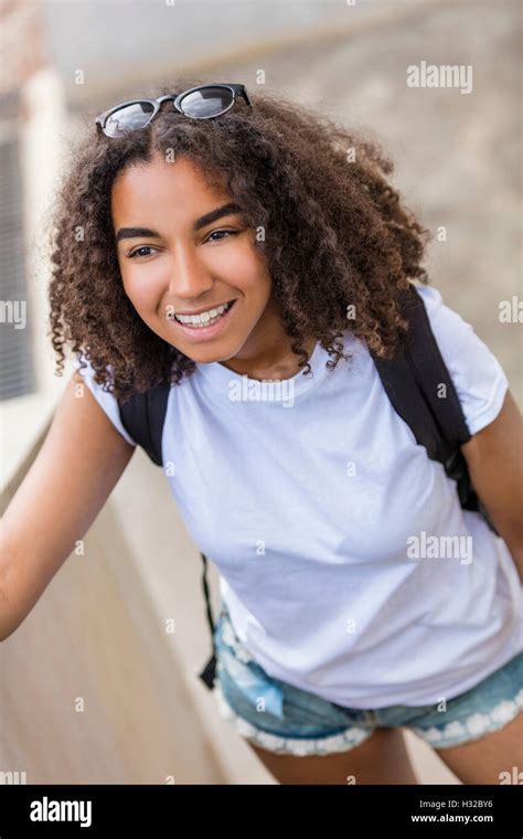 Outdoor Portrait Of Beautiful Happy Mixed Race African American Girl Teenager Female Young Woman