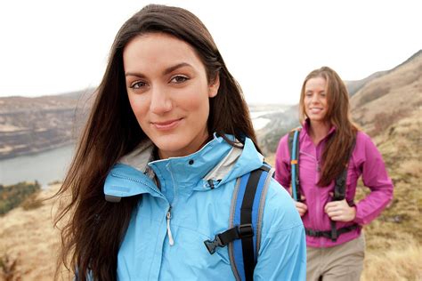 Two Females In Bright Clothes Hiking Photograph By Jordan Siemens