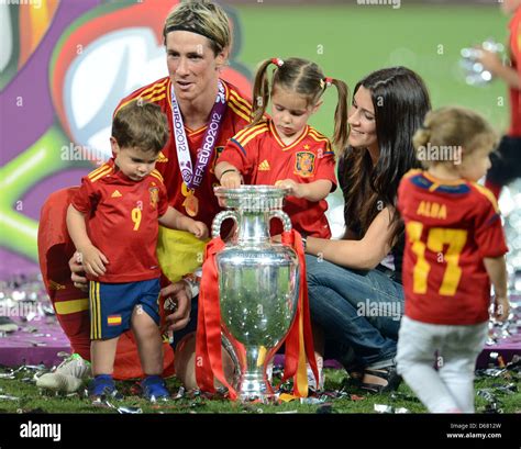 Spains Fernando Torres Kneels Next To The Trophy Together With Wife