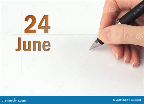 June 24th Day 24 Of Month Calendar Date The Hand Holds A Black Pen