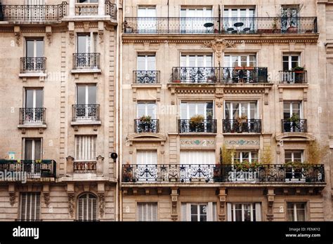 Traditional French Architecture With Typical Windows And Balconies In