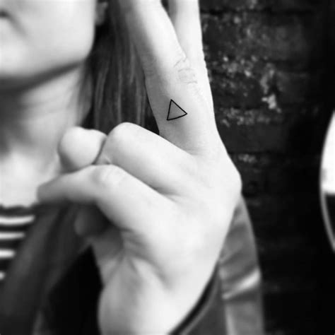 Tiny Minimalistic Triangle Tattoo Located On The