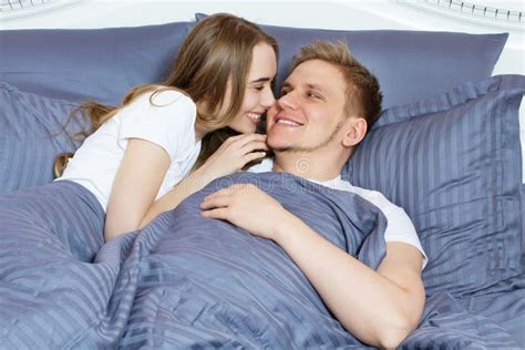 Beautiful Awakened Loving Couple In Bed In The Morning Young Adult
