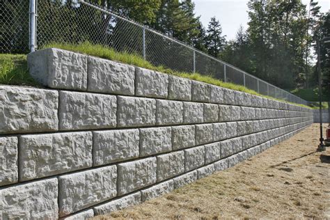 Steps to building a retaining wall with concrete blocks. PRE-CAST PATIO & RETAINING WALL BLOCKS | R. Deso, Inc.