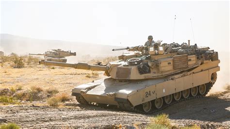 Us Army M1a2 Abrams Tank And M2a3 Bradley Infantry Fighting Vehicle