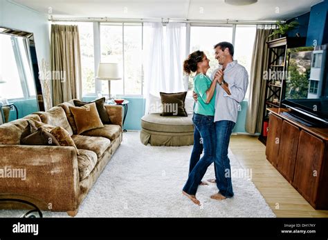 Caucasian Couple Dancing In Living Room Stock Photo Alamy