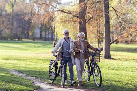 Old Mature Couple With Bikes In Park Stock Image Image Of Mature