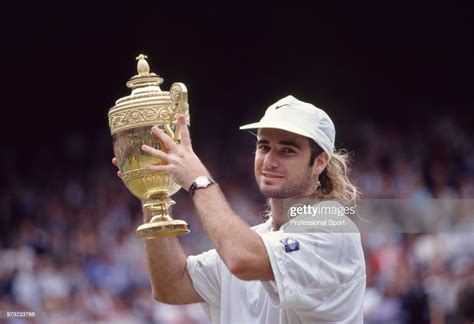 Andre Agassi Of The Usa Lifts The Trophy After Defeating Goran News