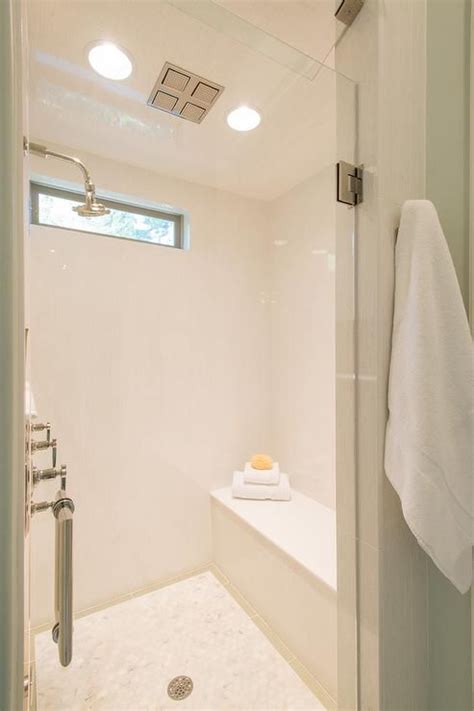 Fabulous White Shower Features A White Tile Surround Framing A High Narrow Window Over A Shower