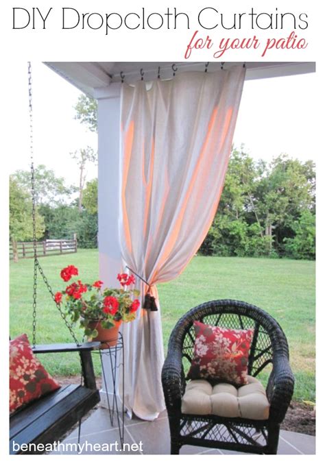 The patio seating is gracious and inviting, with a pretty scrollwork pattern on the upholstery and coordinating sage green. Drop Cloth Curtains for my Patio - Beneath My Heart
