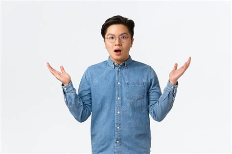 Free Photo Surprised And Confused Asian Man In Braces And Glasses Cant Understand How This