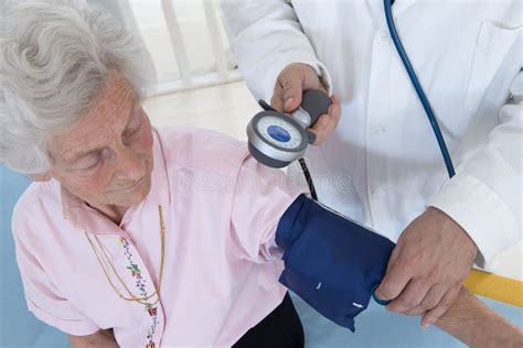 Doctor Taking The Blood Pressure Stock Image Image Of Check Cuff