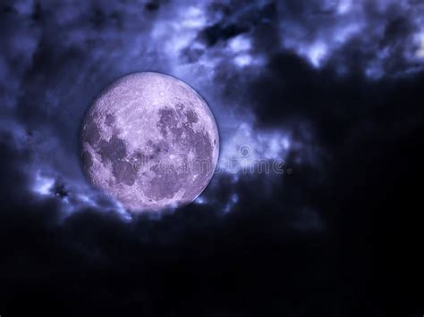 Full Moon With Dark Cloudy Sky With Copy Space On The Right Side Stock