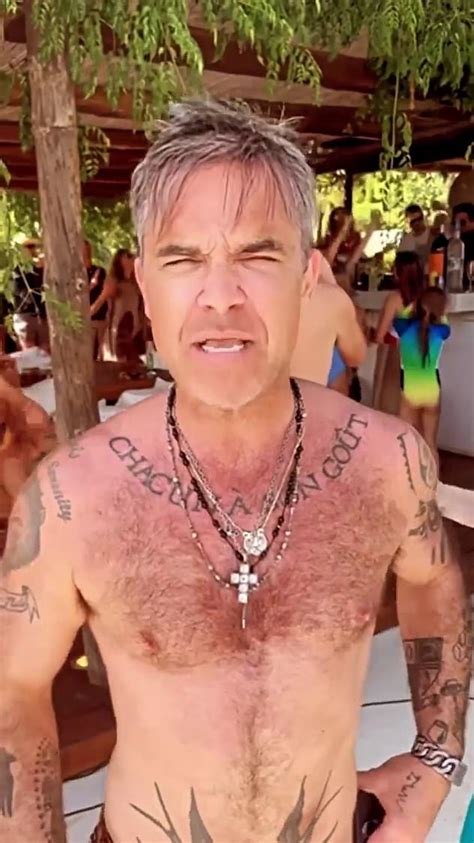 Robbie Williams Dances To Classic Abba Tune In His Swimming Trunks As He Enjoys Ibiza Express