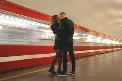 Young Couple Kissing On Platform In Underground · Free Stock Photo