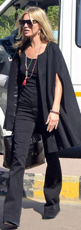 Who Made Kate Moss Black Flared Jeans Black Sunglasses And Black Handbag Fashion Kate